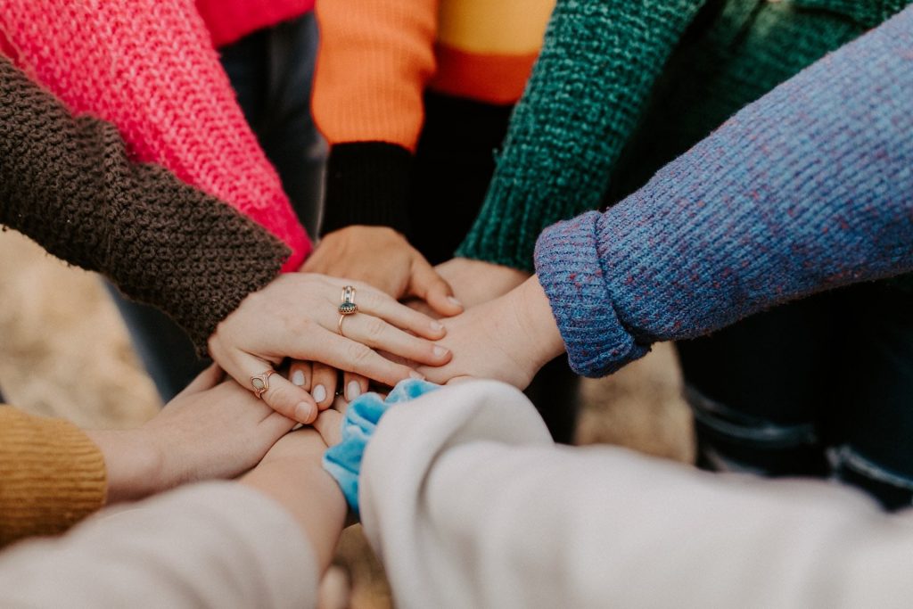 hands together in the centre of a circle