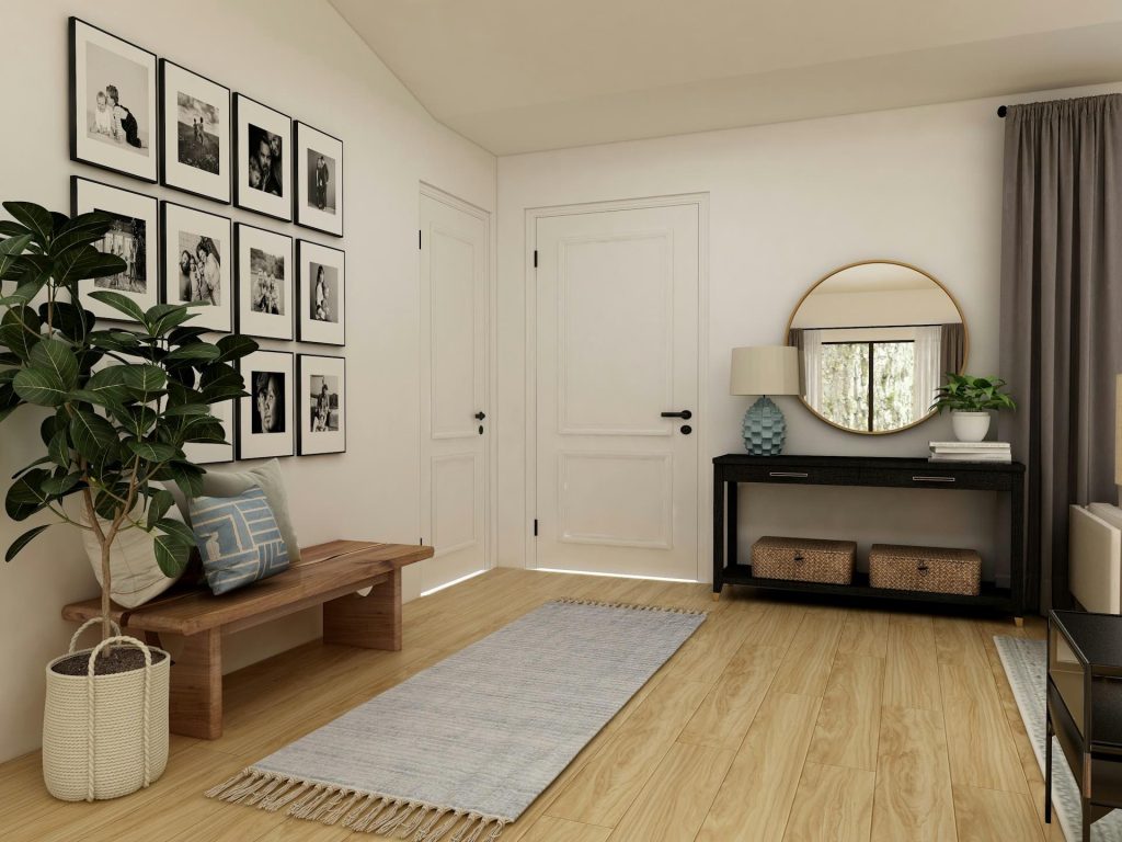 hallway with black and white wall art and mirror